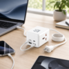 REMAX RP-U157 desktop charging setup REMAX RP-U157 charging a laptop and phone on a modern desk